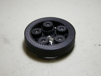 Based off of a combound planetary gear system, when one ring is fixed the other will spin.