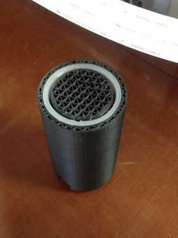 The 3D printed sleeve slides into the part mid print.