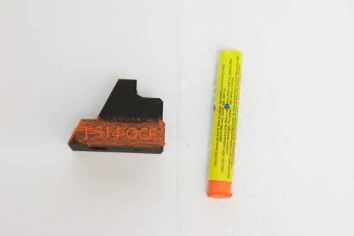 Wipe the tip of the engraver filler across the part.