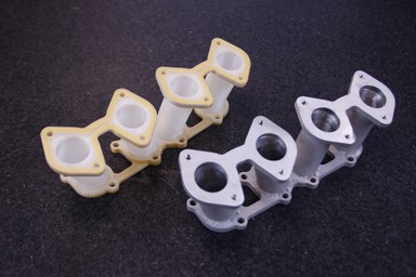 The 3D printed runners next to their machined counterparts.